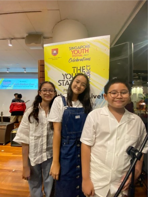 Students posing for a photograph in a song writing competition